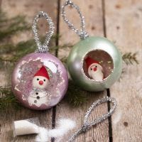 Christmas baubles decorated with Art Metal paint, glitter and Silk Clay mini figures